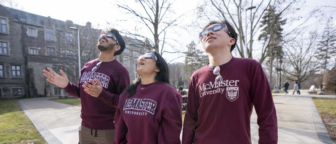 McMaster students wearing solar safety glasses